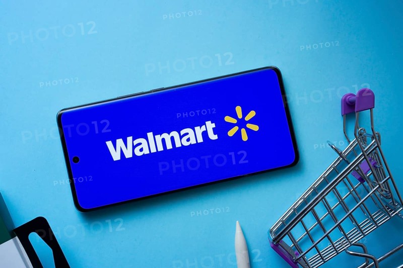 Dhaka, Bangladesh- 03 July 2025: Smartphone displaying Walmart logo with shopping cart on a blue background