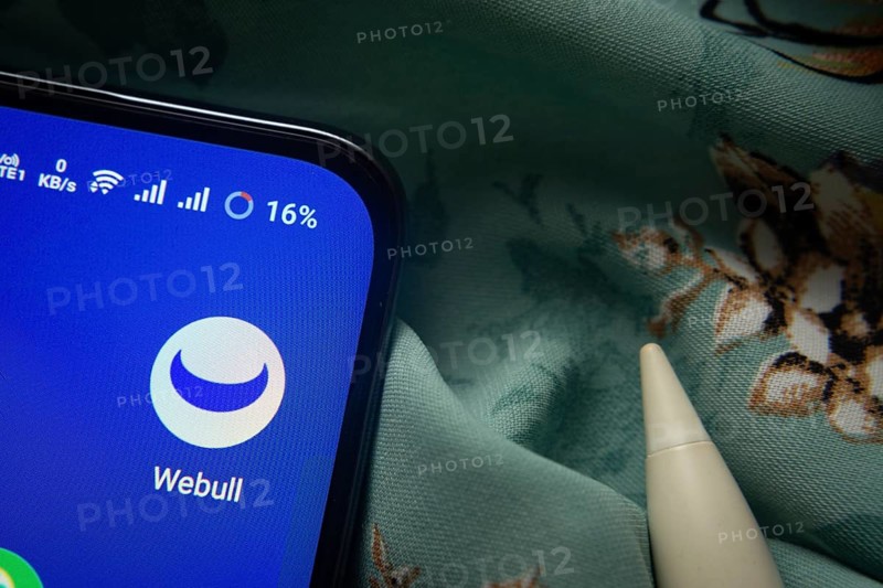 Dhaka, Bangladesh- 07 May 2025: webull app icon is seen on smartphone