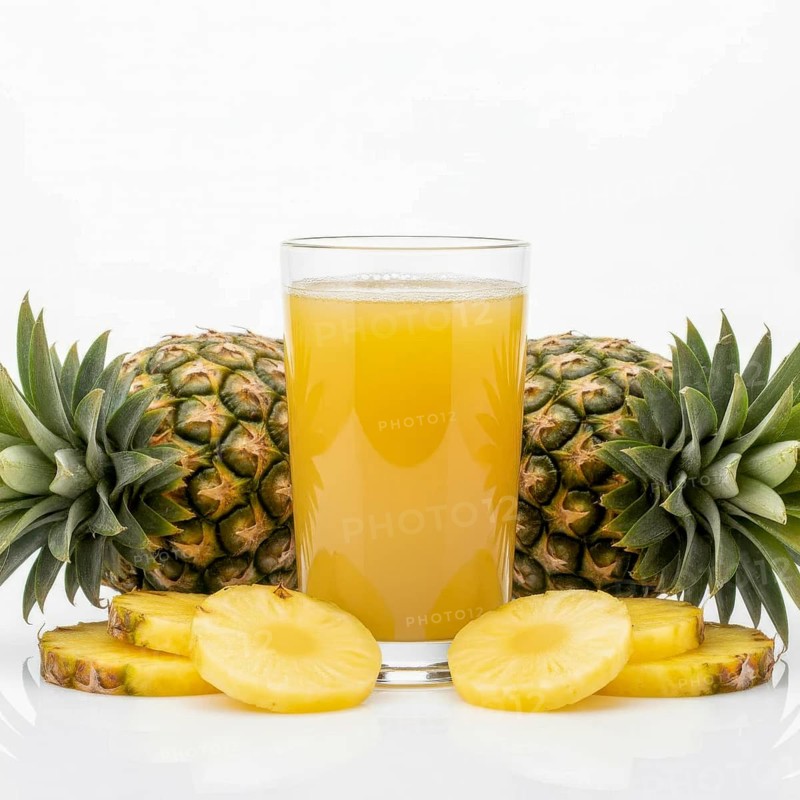 A refreshing glass of pineapple juice is surrounded by whole pineapples and sliced pieces, perfect for a healthy breakfast or tropical drink, AI generated