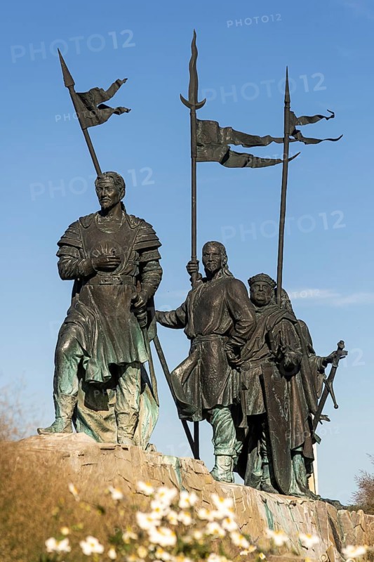 Bronze warrior statues with flags, conveying a historic and majestic feeling, stand against a blue sky, Tulln Weinviertel Lower Austria Austria