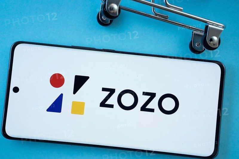 Dhaka, Bangladesh- 03 July 2025: Smartphone screen showing the ZOZO logo with shopping cart wheels on a blue background