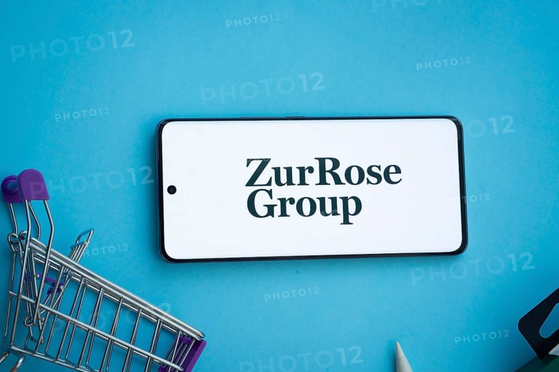 Dhaka, Bangladesh- 03 July 2025: Smartphone displaying Zur Rose Group logo with shopping cart on a blue background