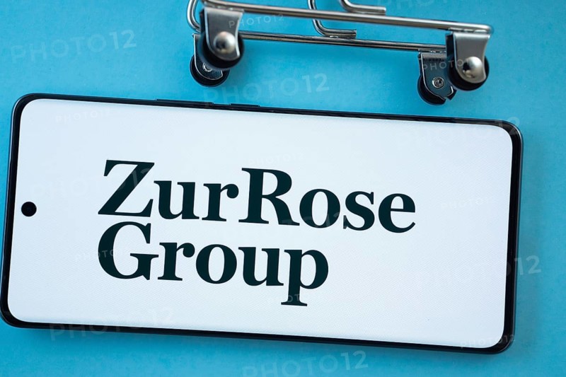 Dhaka, Bangladesh- 03 July 2025: Smartphone screen showing the Zur Rose Group logo with shopping cart wheels on a blue background