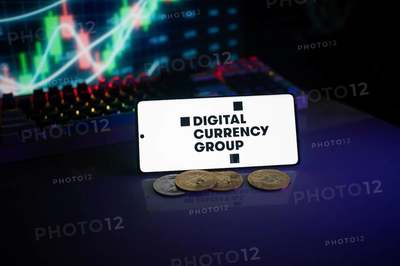 Digital Currency Group screen with coins in front of a vibrant stock chart setting
