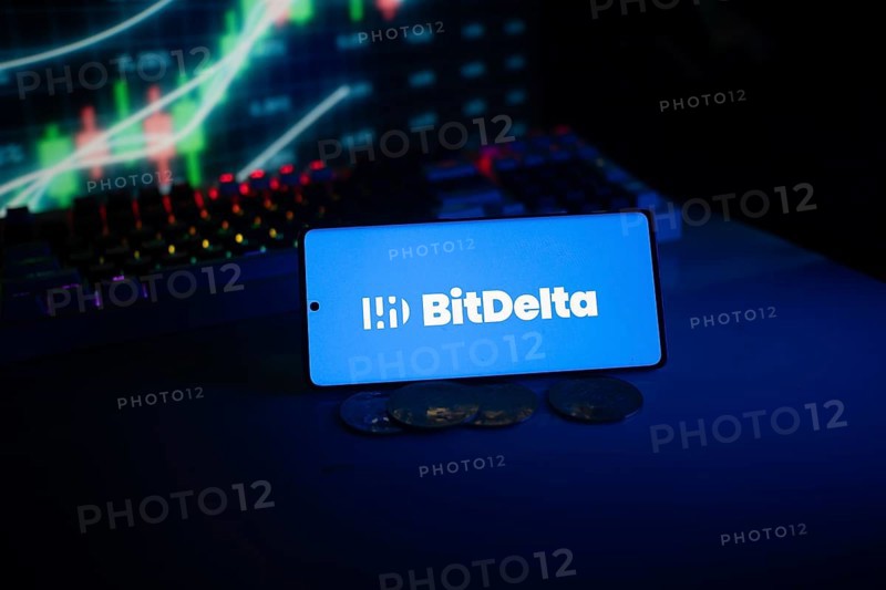BitDelta logo presented with coins and trading charts in a neon blue setting