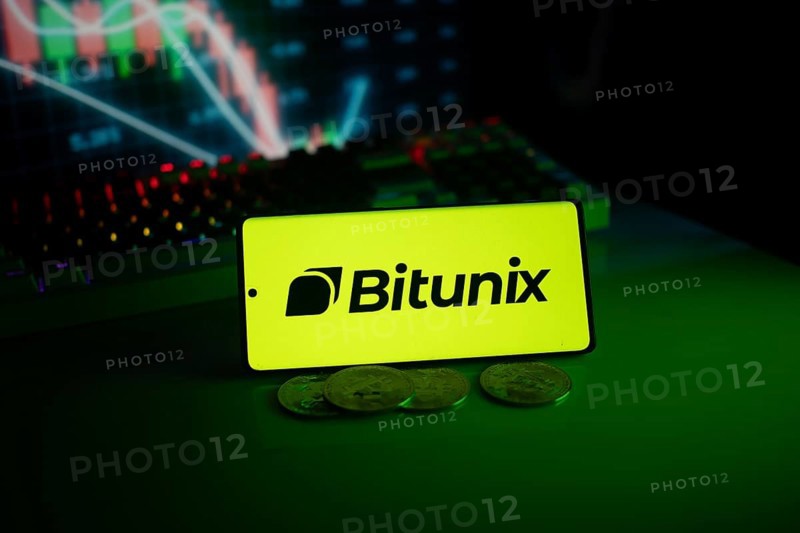 Bitunix logo in a bright neon green setting with coins and trading charts in the background
