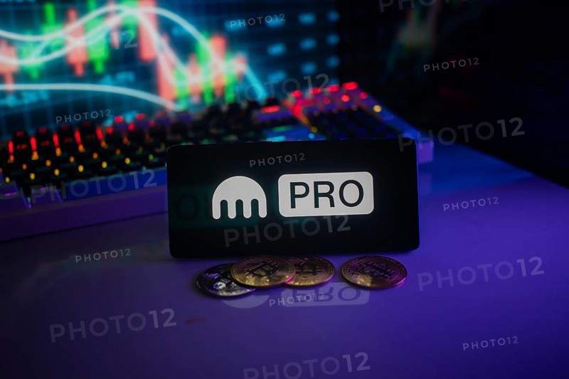 Kraken's PRO logo amid cryptocurrency coins and glowing market graph