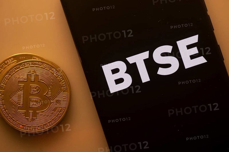 A Bitcoin coin paired with a smartphone displaying the BTSE logo in orange