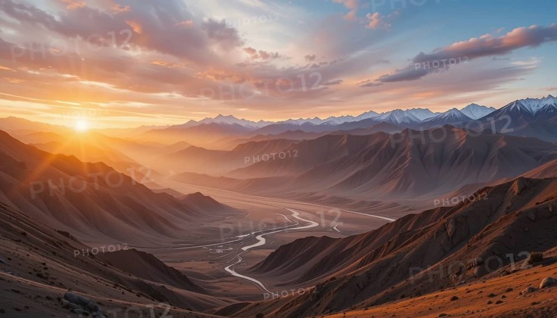 The sun rises, casting a warm glow over the mountains and valley below, creating a breathtaking landscape. The river meanders through the valley, AI generated