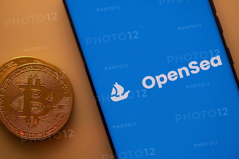 Bitcoin coin alongside OpenSea logo on a blue background, related to NFT trade