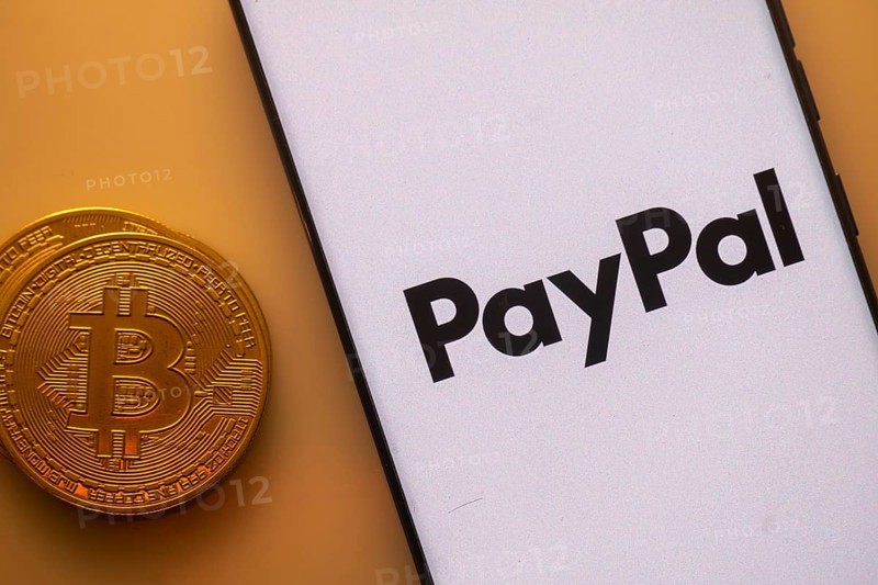 Bitcoin coin beside PayPal logo on a white background, symbolizing digital transactions