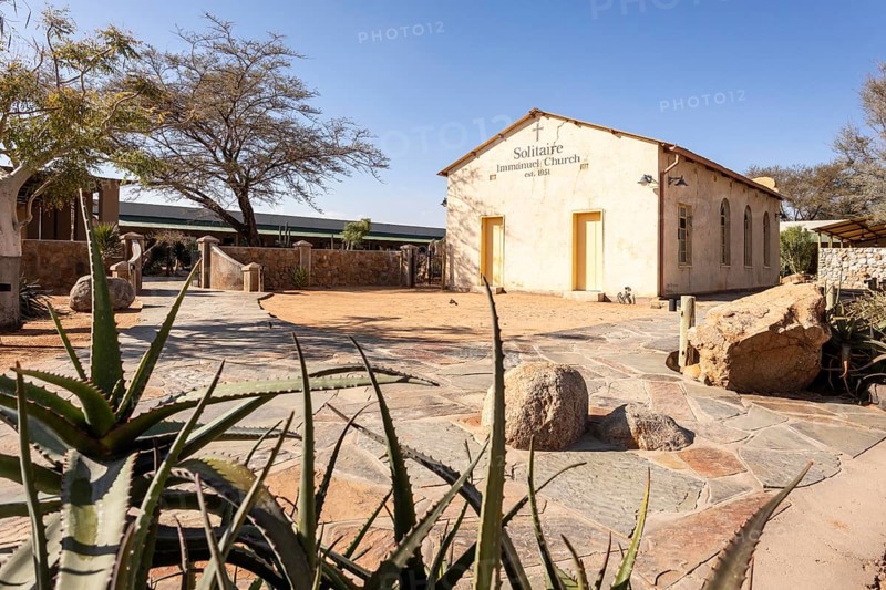 Solitaire Immanuel Church in Namibia - 27 Augusto, 2025: a small desert church surrounded by golden sand dunes and rugged mountains