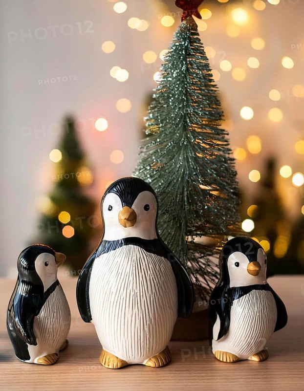 Three charming penguin figurines gather around a small christmas tree, illuminated by warm, sparkling lights, creating a festive holiday scene, AI generated
