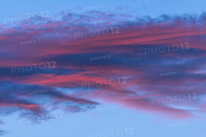 Beautiful sky with twilight showing pink and blue clouds. The colours anticipate day turning into night. Scene is calm and peaceful