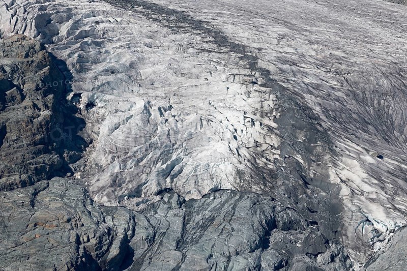 Impressive scene shows lines and textures on residual ice cream in mountains. Daylight emphasises the beauty of this unique, cold landscape. Gorner Glacier, Zermatt, Valais, Alps, Swiss