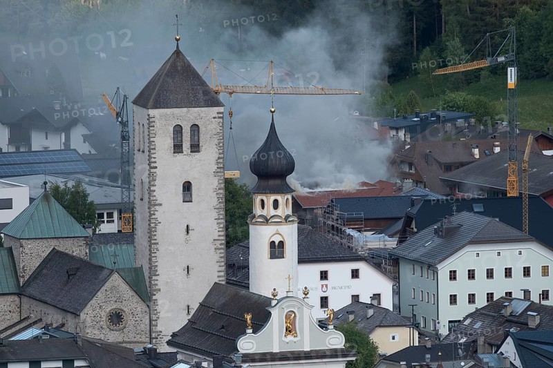 View of a burning building in the town centre of San Candido, San Candido, Val Pusteria, Sesto Dolomites, Dolomites, South Tyrol, Italy