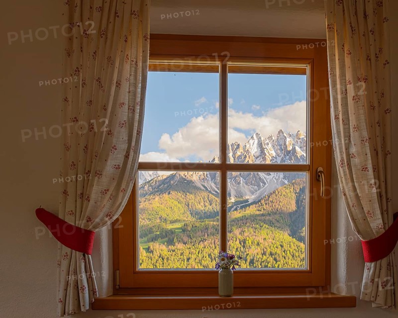 View through a window to the Dolomites in the foreground a small vase with meadow flowers on the windowsill, San Candido, Val Pusteria, Sesto Dolomites, Dolomites, South Tyrol, Italy