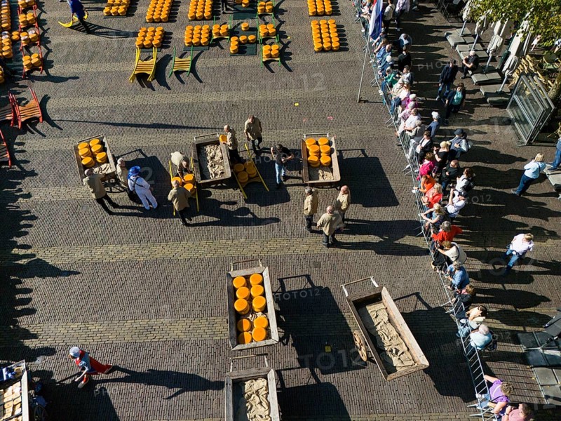 Dutch cheese market with people transporting cheese on carts, watched by spectators, aerial view, cheese, cheese market, Alkmaar, Alkmar, Noord-Holland, Noord-Holland, Netherlands