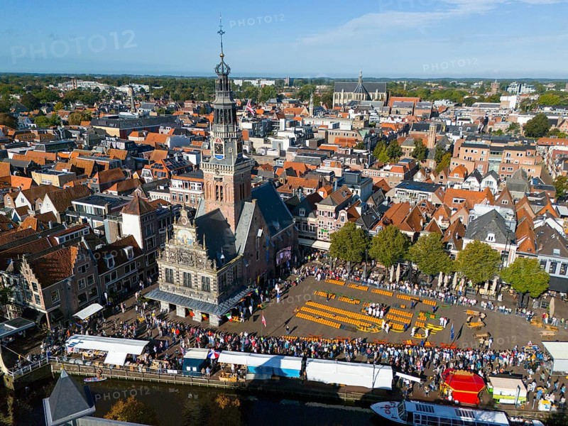 Historic city view with a tower and a busy cheese market in the old town centre, aerial view, cheese, cheese market, former city scales, Alkmaar, Alkmar, Noord-Holland, Noord-Holland, Netherlands
