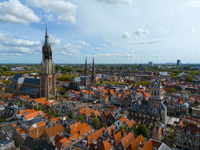 View of the city centre with several churches and red roofs on a cloudy day, aerial view, Nieuwe Kerk, New Church, to the right Maria van Jessekerk, town hall, market square, Delft, Province of South Holland, Zuid-Holland, Netherlands