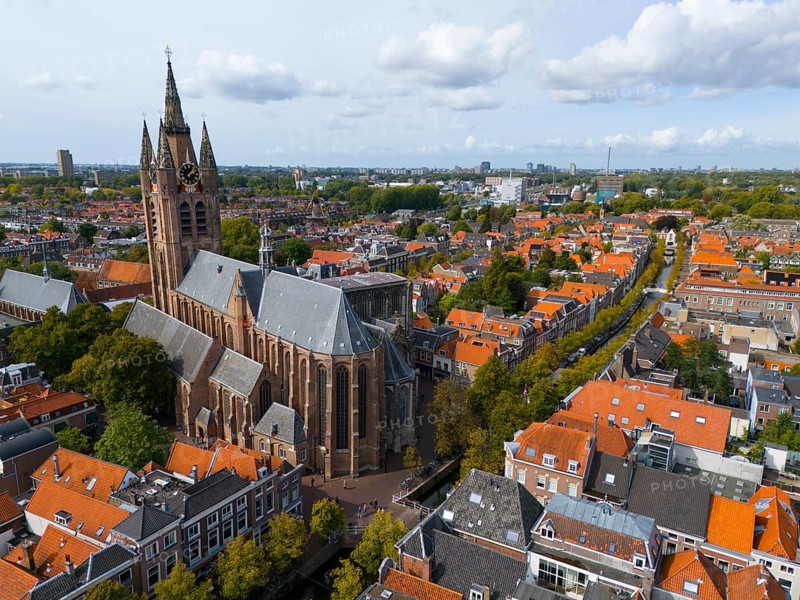 View of the historic city centre with large church and red roofs under a cloudy sky, aerial view, Oude Kerk, Old Church, Market Square, Delft, Province of South Holland, Zuid-Holland, Netherlands