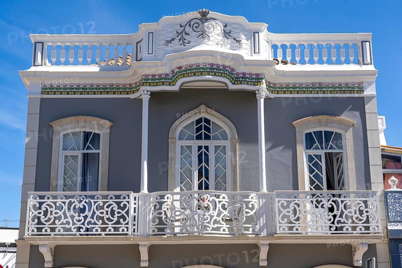 Facade of buildings in Tavira, old town, in the east of the Algarve, Portugal