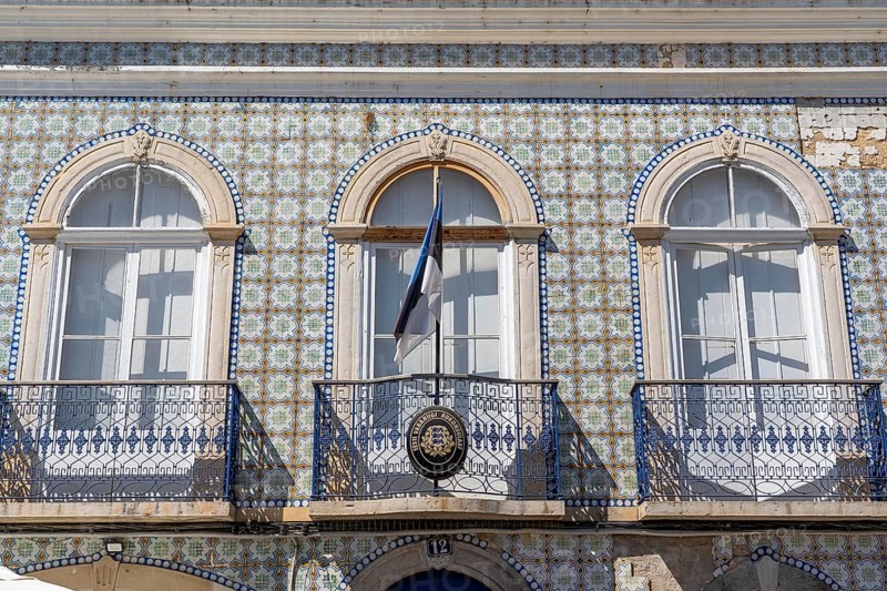 Facade of buildings decorated with tiles, azulejos, coloured tiles on facades, in Tavira, old town, in the east of the Algarve, Portugal