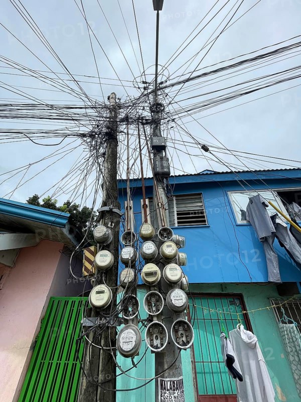 Infrastructure, energy supply, electricity, power lines, electricity meters of various houses, San Carlos, Negros Occidental, Philippines
