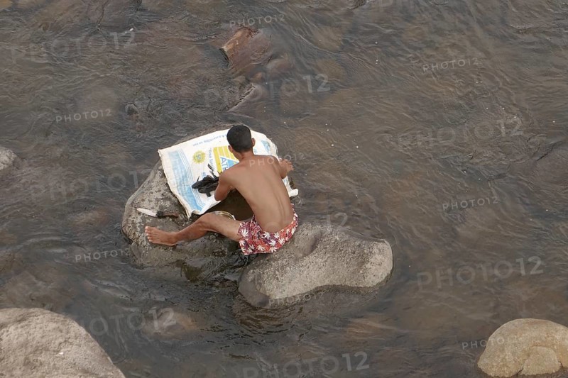 Fisherman has caught catfish, Negros Occidental, Philippines