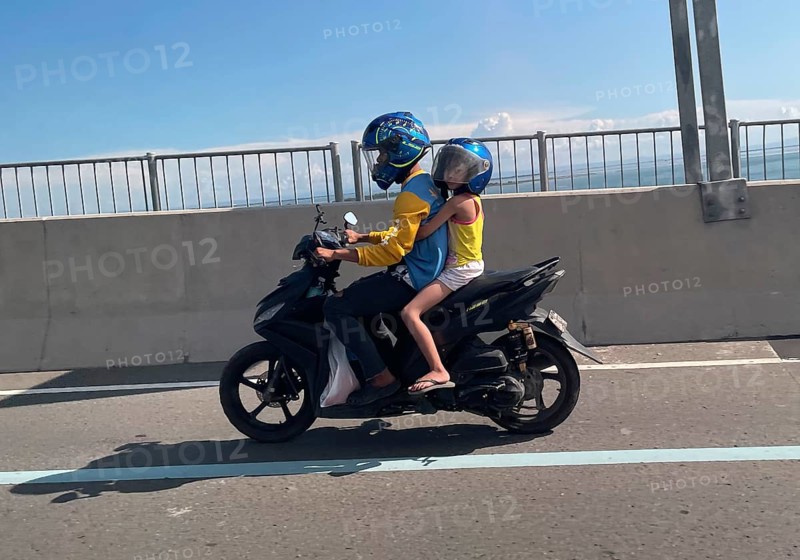 Father with child on motorbike, Cebu City, Cebu, Philippines