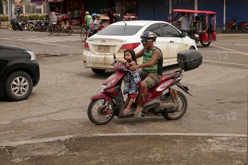 Man with moped and small daughter, Transport, Mobility, Negros Occidental, Philippines