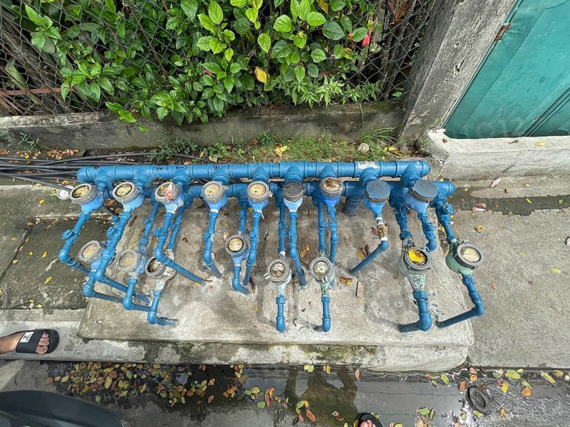 Infrastructure, water pipes and water meters of various houses, San Carlos, Negros Occidental, Philippines