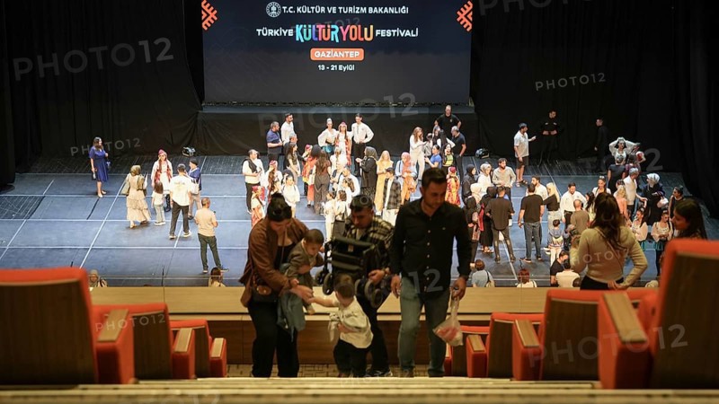 Audience members gather inside the theater before the start of the Fire of Anatolia show in Gaziantep. The Turkish dance ensemble, founded by Mustafa Erdogan, is one of the largest in the world with more than 120 dancers, Gaziantep, Gaziantep, Türkiye