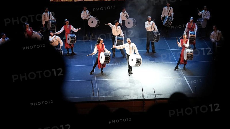 Dozens of members of Fire of Anatolia perform a drumming sequence during a cultural festival at Gaziantep University. The troupe is one of the largest dance ensembles in the world and includes 120 members, Gaziantep, Gaziantep, Türkiye