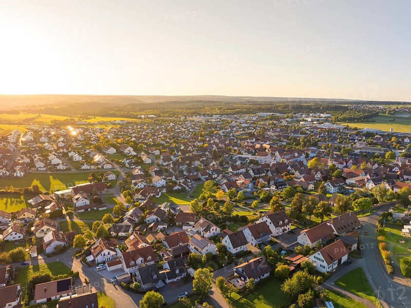 Aerial view of a village at sunset with densely built-up houses and rural flair, Althengstett, district of Calw, Germany