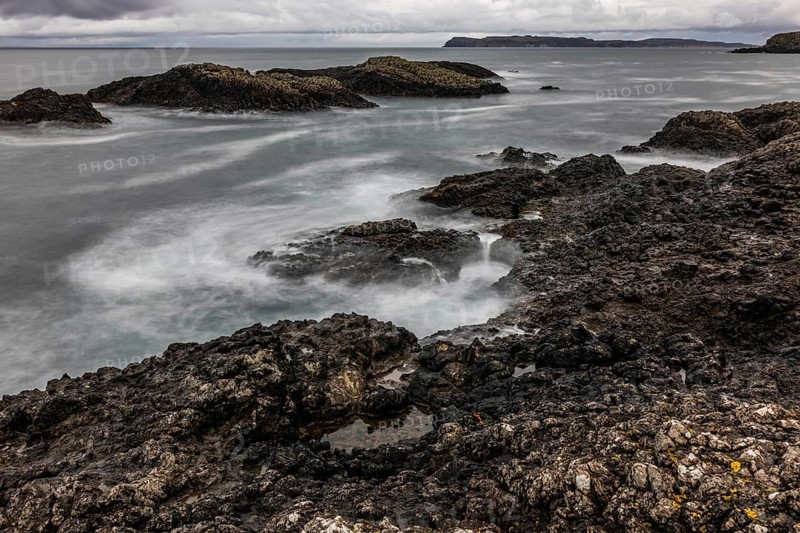 Rocky coast, offshore islands, Ballintoy Harbour, Causeway Coastal Route, Antrim, Northern Ireland, Great Britain