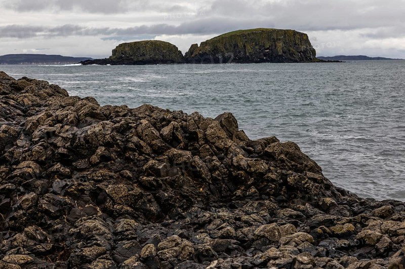 Rocky coast, offshore islands, Ballintoy Harbour, Causeway Coastal Route, Antrim, Northern Ireland, Great Britain