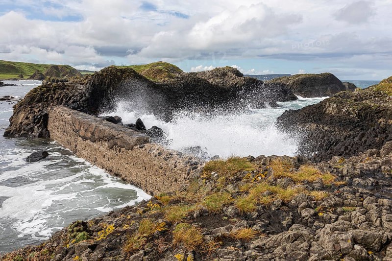 Breakwater at the fishing harbour, Ballintoy Harbour, Causeway Coastal Route, Antrim, Northern Ireland, Great Britain
