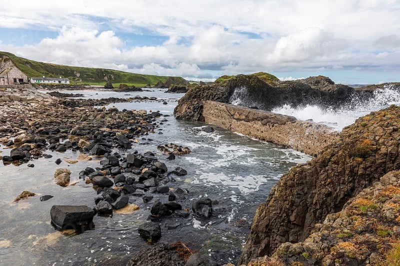 Breakwater at the fishing harbour, Ballintoy Harbour, Causeway Coastal Route, Antrim, Northern Ireland, Great Britain
