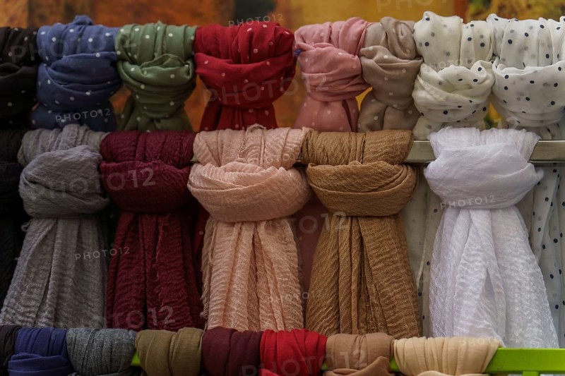 Warm and stylish scarves hanging, perfect for adding a touch of color and comfort to any outfit in ronda, malaga, spain