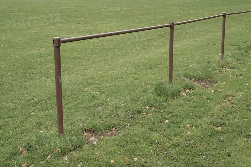 Borken, NRW, Germany, Metal railing boundary defining a sports field or park area