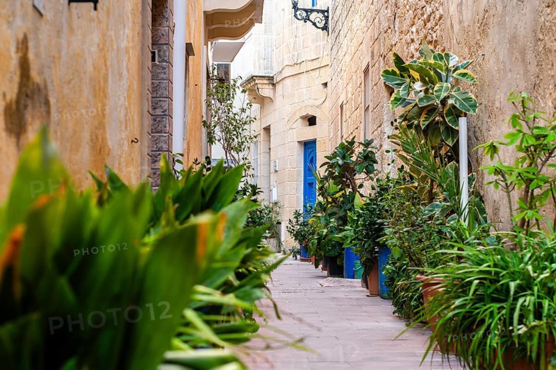 Charming medieval full of flowers street of Rabat Mdina in Malta