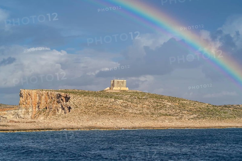 Amazing view of rainbow after the rain above Comino island, Malta