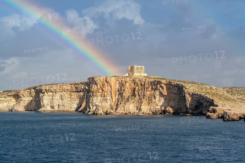 Amazing view of rainbow after the rain above Comino island, Malta