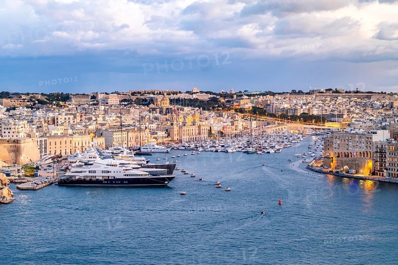 Beautiful evening view of illuminated Valletta, Birgu with Saint Angelo Fortress, capital city of Malta