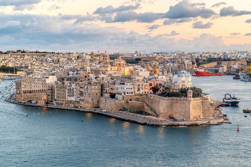 Beautiful sunset view of Valletta city with Saint Angelo Fortress, capital city of Malta