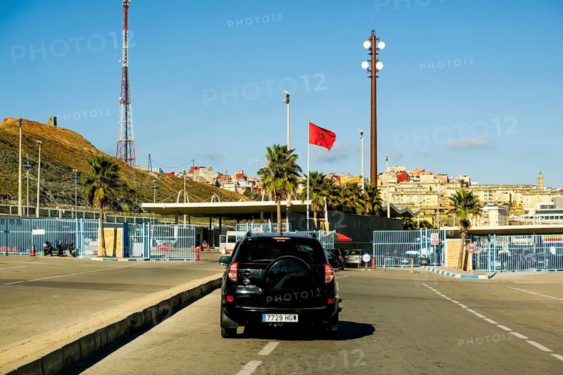 Fnideq, Morocco - December 26 2023: car passing country border between Morocco and Spain