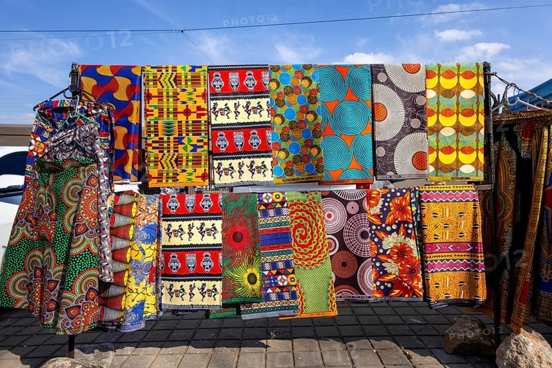 Vibrant african fabrics on display in Soweto, south africa. bold ankara prints and wax designs reflect the rich culture, color, and creativity of local textile art