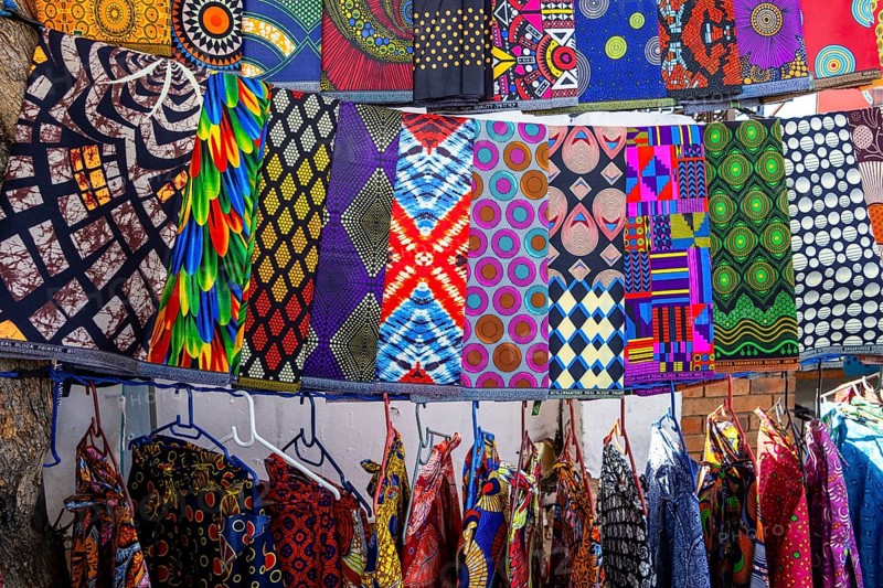 Vibrant african fabrics on display in Soweto, south africa. bold ankara prints and wax designs reflect the rich culture, color, and creativity of local textile art