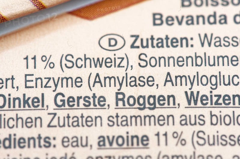 List of ingredients on a carton of oat milk. Focus on enzymes